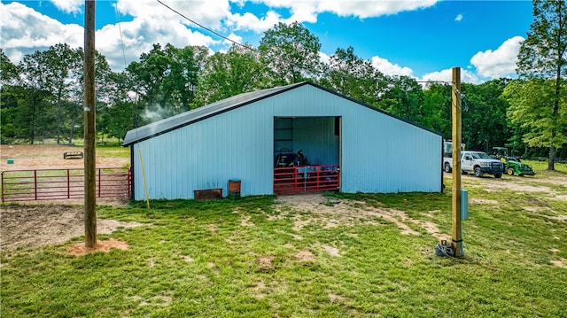 view of outdoor structure with a yard