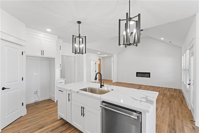 kitchen featuring dishwasher, light wood-type flooring, white cabinets, and lofted ceiling