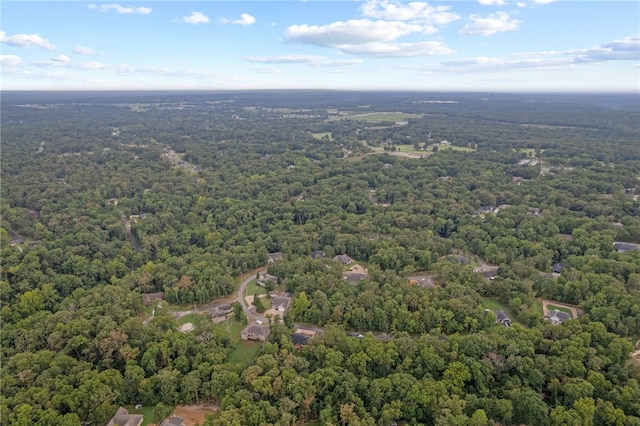 drone / aerial view featuring a forest view