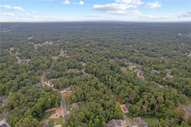 drone / aerial view featuring a view of trees