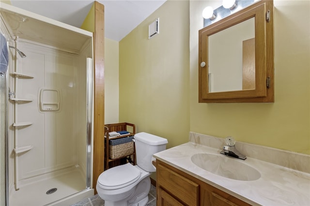 full bathroom featuring vanity, toilet, visible vents, and a stall shower