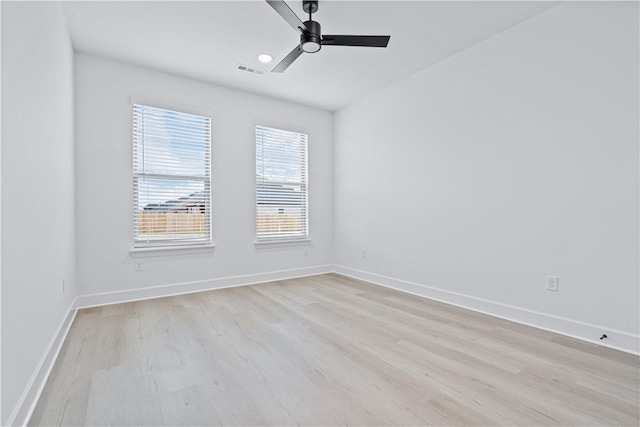 unfurnished room with light hardwood / wood-style floors, ceiling fan, and plenty of natural light