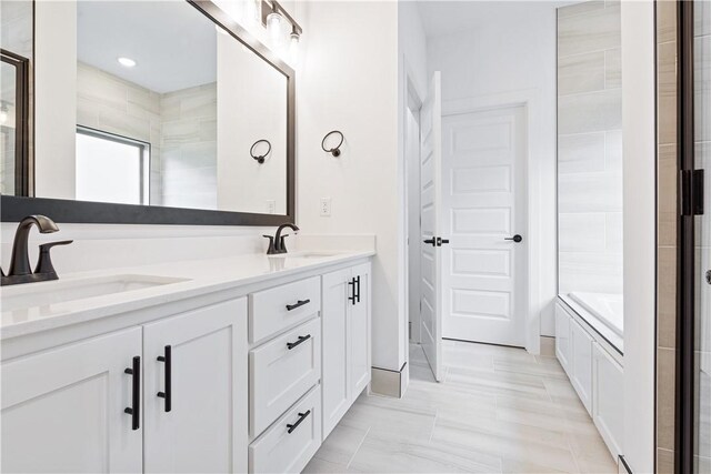 bathroom featuring a bathtub and vanity