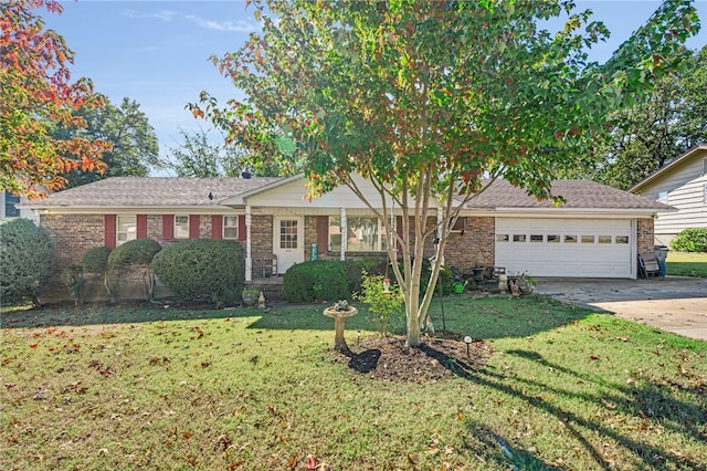 view of front of home featuring a garage and a front yard