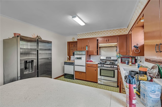 kitchen featuring appliances with stainless steel finishes and crown molding