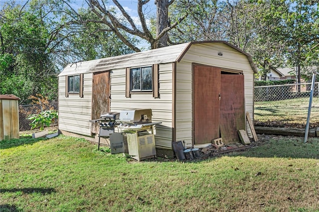 view of outdoor structure with a lawn