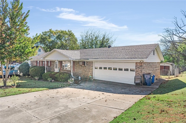 single story home with a front yard and a garage