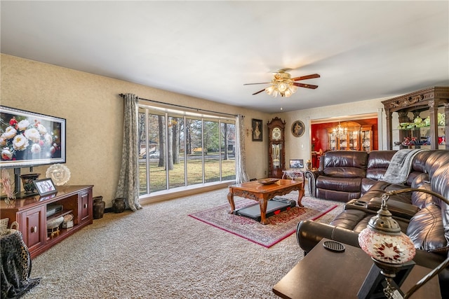 carpeted living room featuring ceiling fan