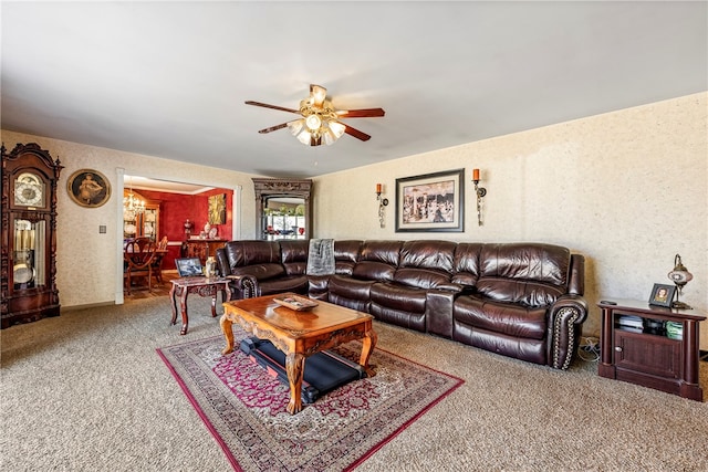 living room with ceiling fan and carpet floors