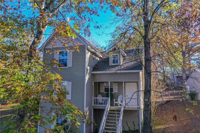 view of front of house with a porch and stairway