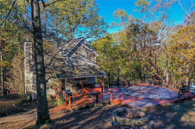 exterior space featuring an outdoor fire pit