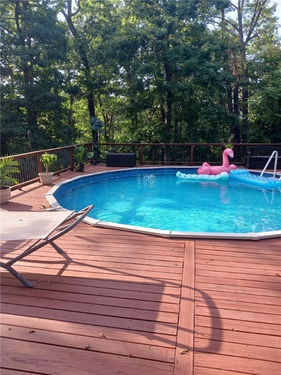 outdoor pool featuring a deck