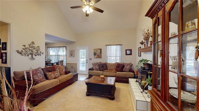 living room with high vaulted ceiling and a ceiling fan