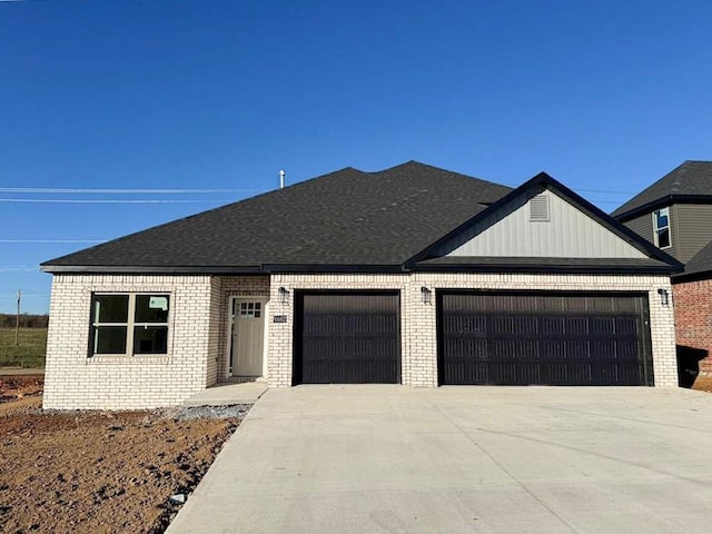 ranch-style house featuring a garage