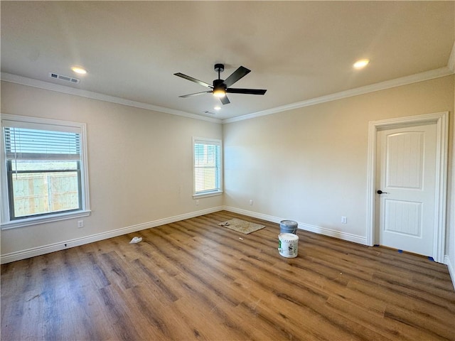 unfurnished room featuring ceiling fan, hardwood / wood-style floors, and ornamental molding