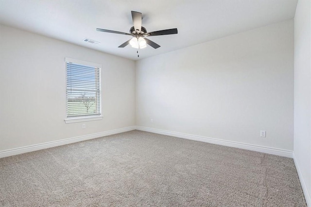 6602 SW Spindle St, Bentonville, AR 72713 - spare room featuring baseboards, carpet floors, ceiling fan, and visible vents
