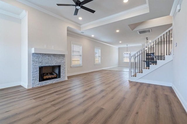 6602 SW Spindle St, Bentonville, AR 72713 - unfurnished living room featuring baseboards, stairs, and visible vents