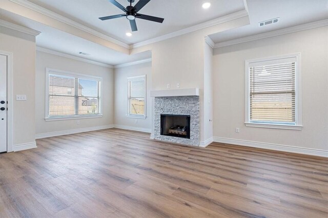 6602 SW Spindle St, Bentonville, AR 72713 - unfurnished living room with baseboards, visible vents, a ceiling fan, and wood finished floors