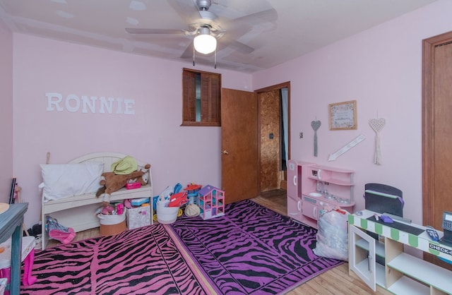 bedroom with ceiling fan and light hardwood / wood-style floors