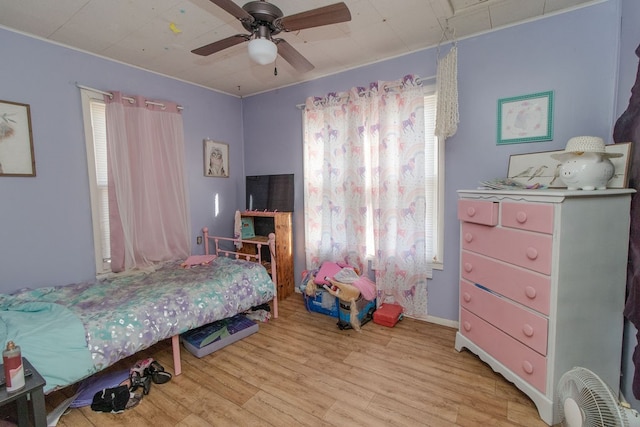 bedroom featuring light hardwood / wood-style floors and ceiling fan