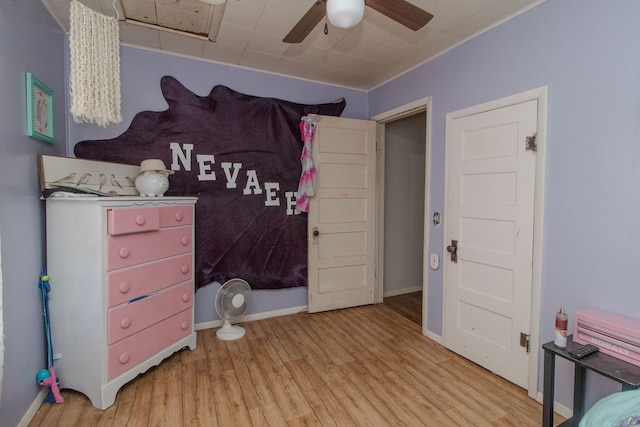 bedroom featuring light hardwood / wood-style floors and ceiling fan