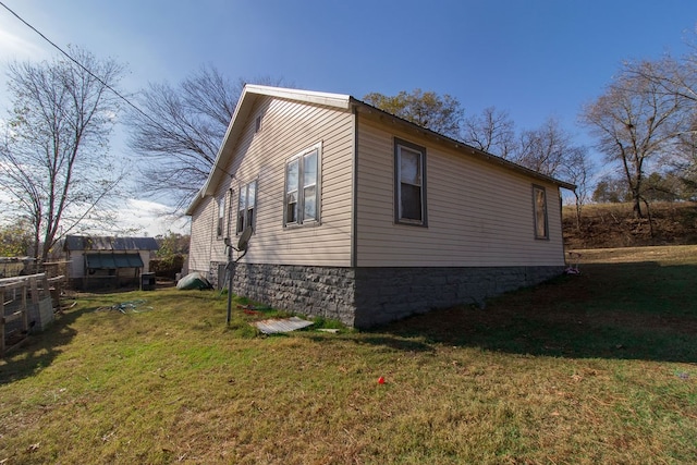 view of home's exterior featuring a yard