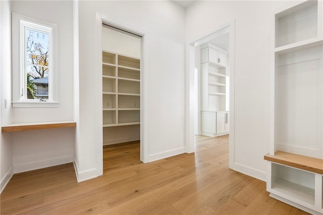 mudroom with light hardwood / wood-style flooring