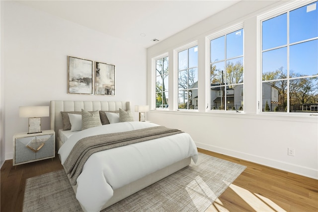 bedroom with hardwood / wood-style flooring