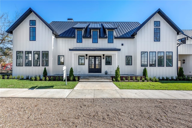 modern inspired farmhouse featuring a front lawn