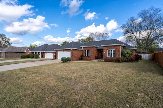 ranch-style house featuring a front yard and a garage