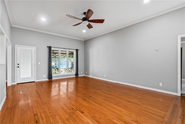 unfurnished room with hardwood / wood-style flooring, ceiling fan, and crown molding