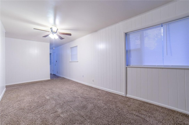 carpeted empty room with ceiling fan