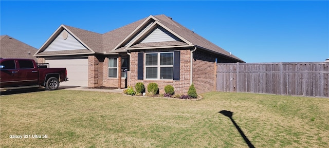 view of front of home with a garage and a front lawn