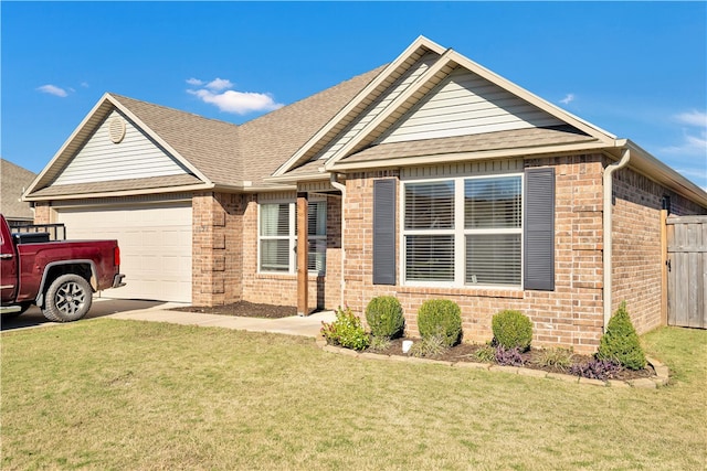 view of front of house with a front yard and a garage