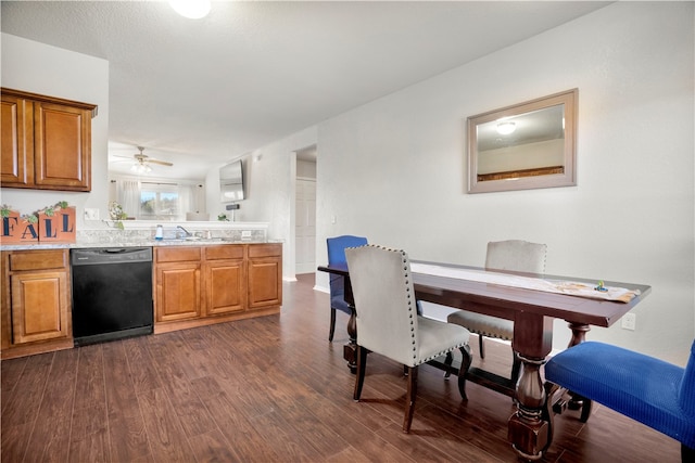 kitchen with ceiling fan, sink, black dishwasher, and dark wood-type flooring