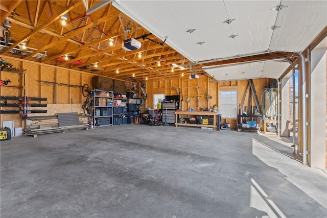 garage featuring a workshop area and a garage door opener