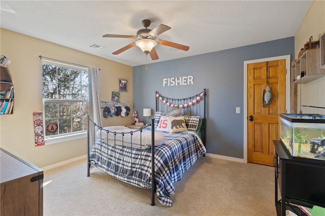 carpeted bedroom featuring ceiling fan