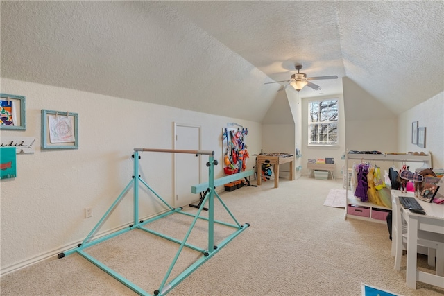 game room with carpet, ceiling fan, a textured ceiling, and vaulted ceiling