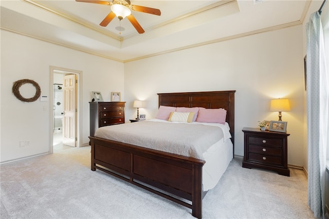 bedroom featuring ceiling fan, ornamental molding, ensuite bathroom, and light carpet