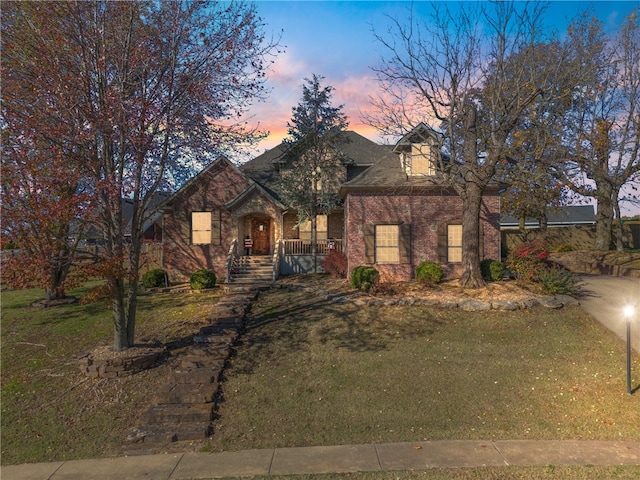 view of front of home with a lawn