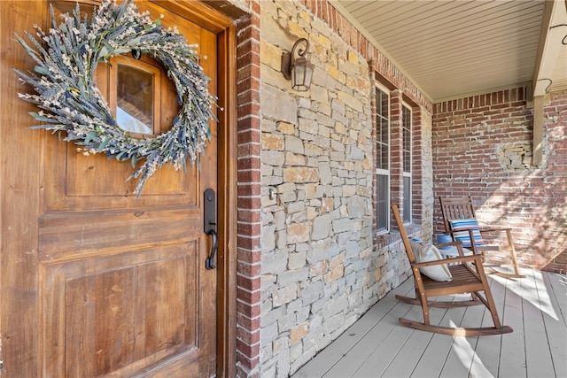 doorway to property with a porch