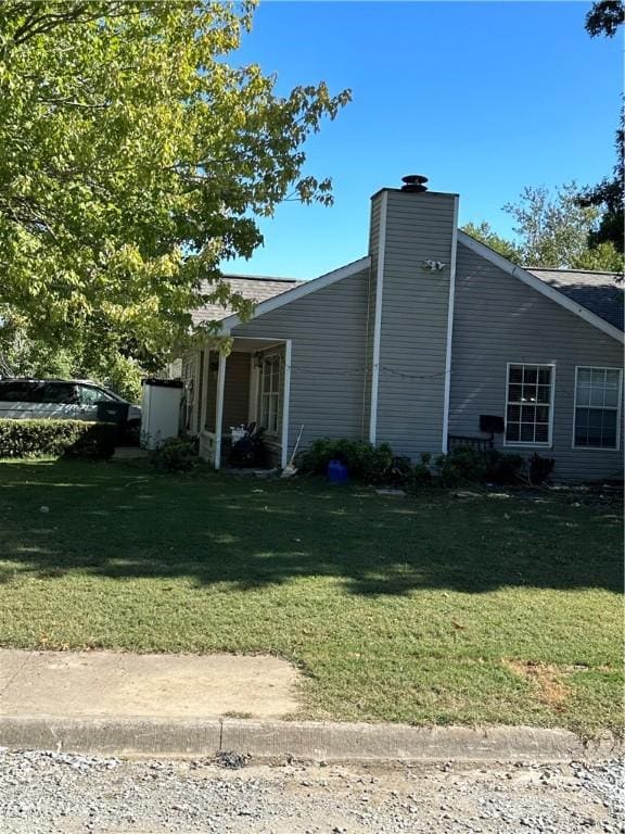 view of property exterior featuring a yard