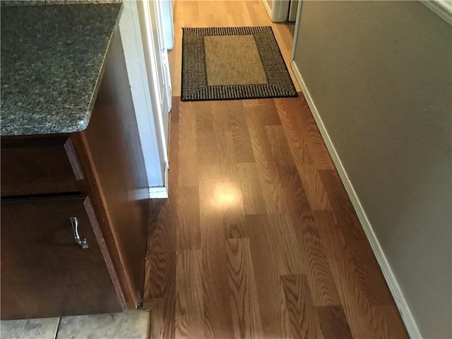 details with hardwood / wood-style flooring