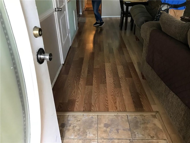 hallway with hardwood / wood-style floors