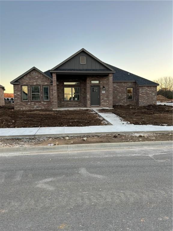 4833 W Planetree St, Fayetteville, AR 72704 - view of front of house with brick siding and board and batten siding