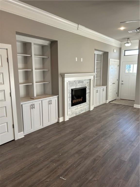 4833 W Planetree St, Fayetteville, AR 72704 - unfurnished living room with crown molding, dark wood-style flooring, a fireplace, built in shelves, and baseboards