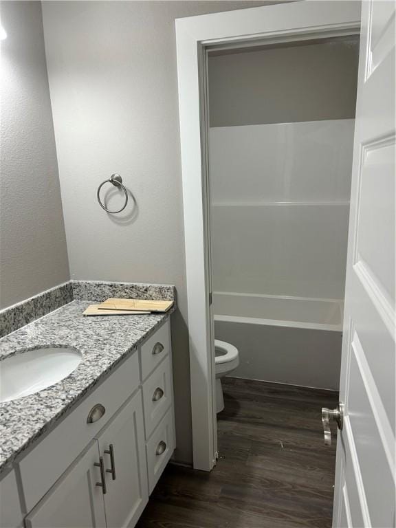 4833 W Planetree St, Fayetteville, AR 72704 - full bathroom with vanity, wood finished floors, and toilet