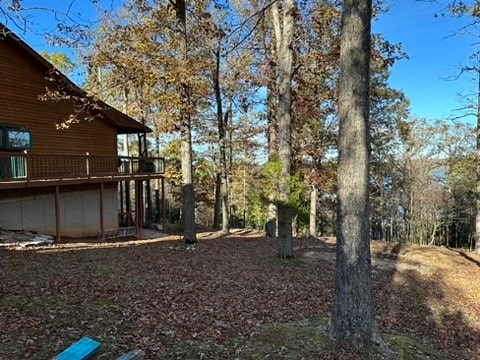 view of yard with a wooden deck