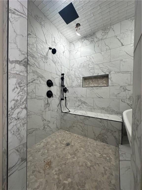 bathroom featuring plus walk in shower