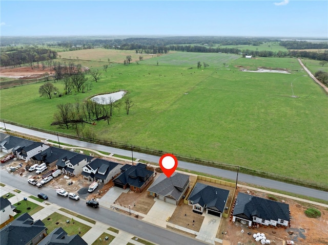 birds eye view of property featuring a residential view and a rural view